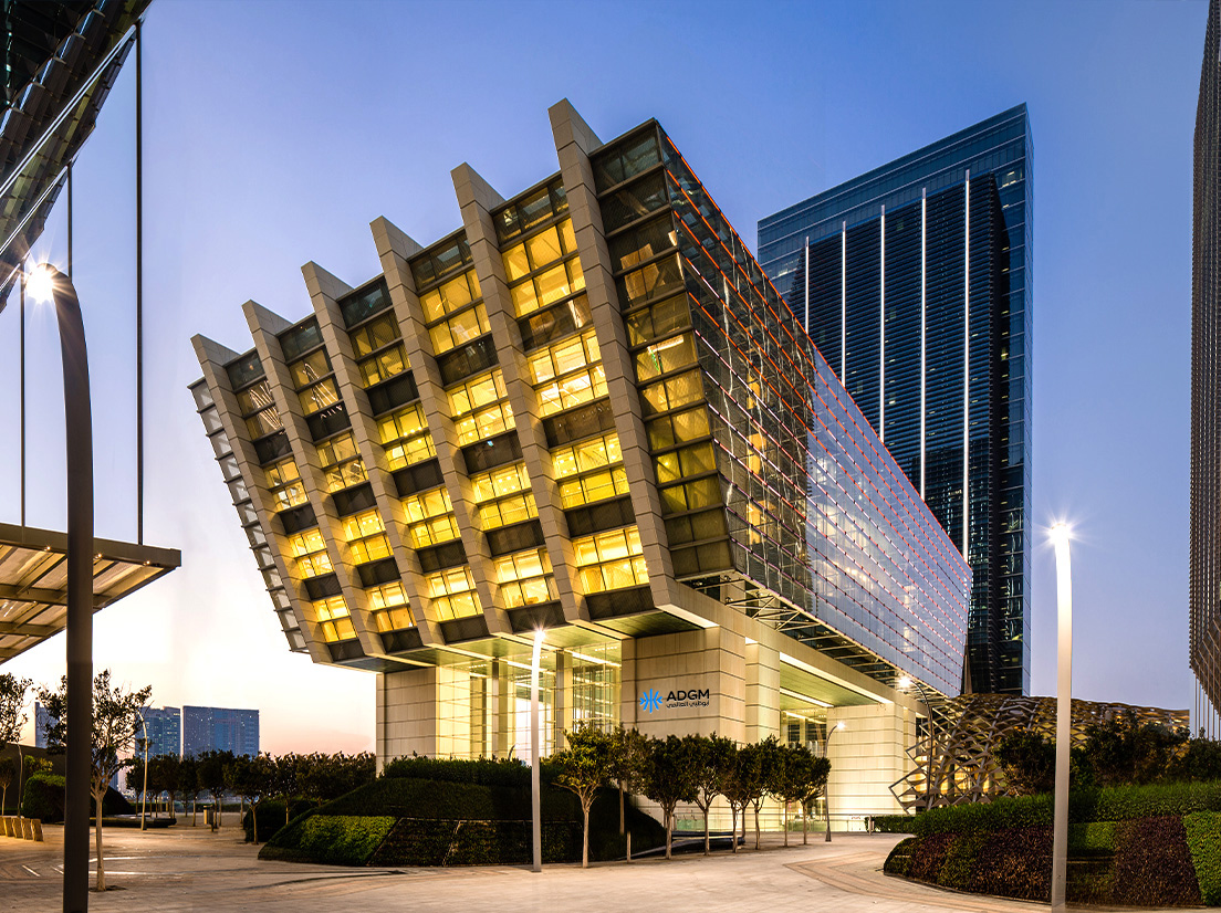 ADGM building illuminated at dusk